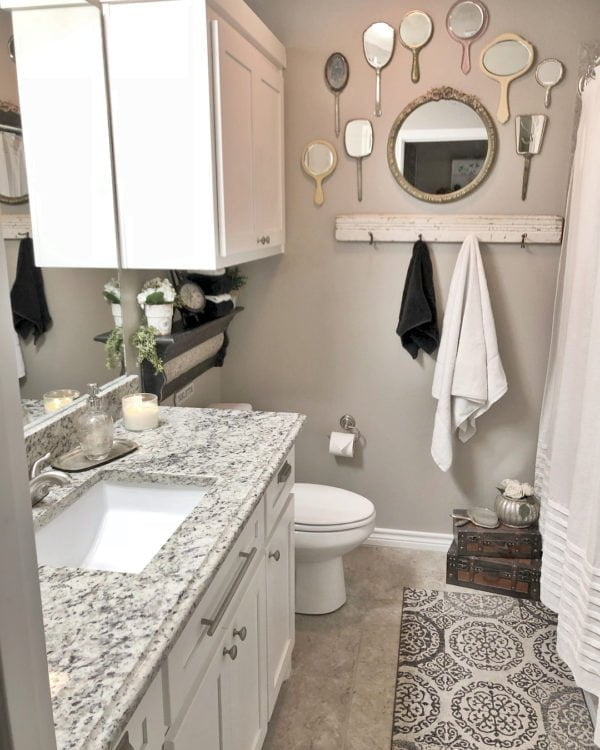  decor idea with a wood plank hanger and a white bathroom cabinet. Love it!   