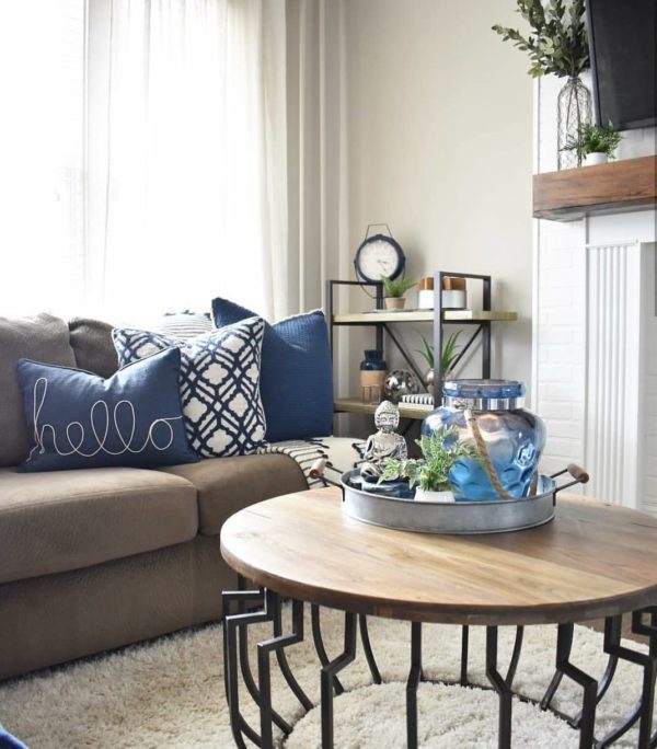  decor idea with a wood-iron shelf rack and all-white fireplace. Love it!   