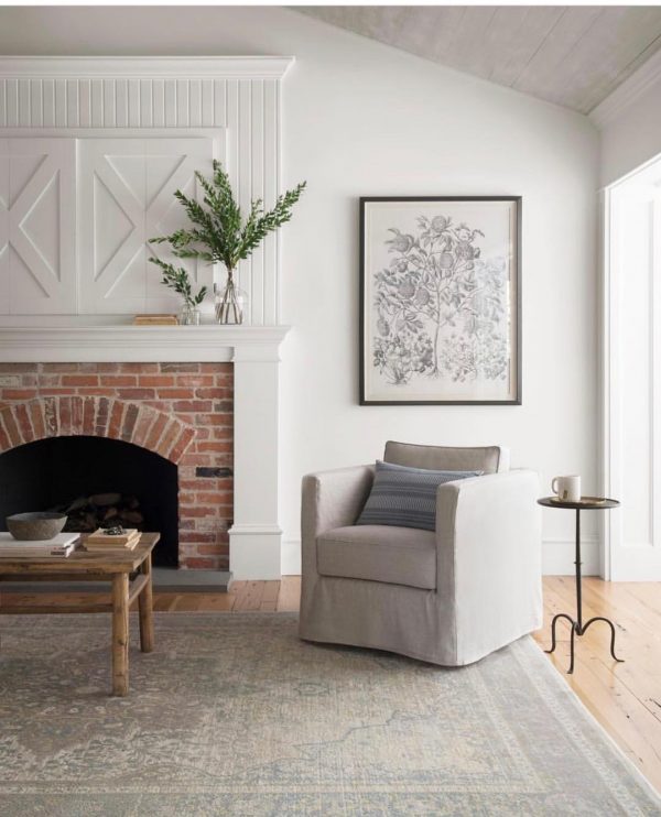  living room decor idea with red-brick fireplace and neutral living room ambient. Love it!  