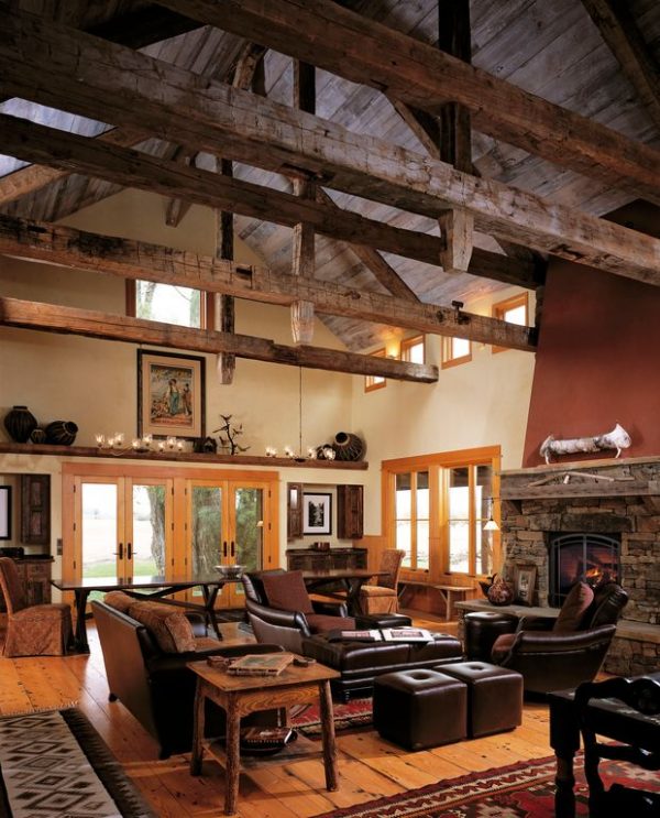 living room decor idea with dark wooden tones and majestic stone fireplace. Love it!