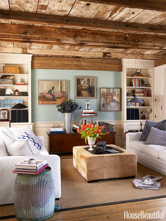 living room decor idea with hippie details and painting-packed walls. Love it!