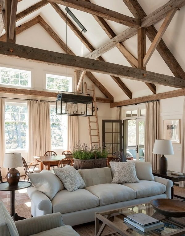  living room decor idea with high wooden pillars and extravagant furniture set. Love it!  