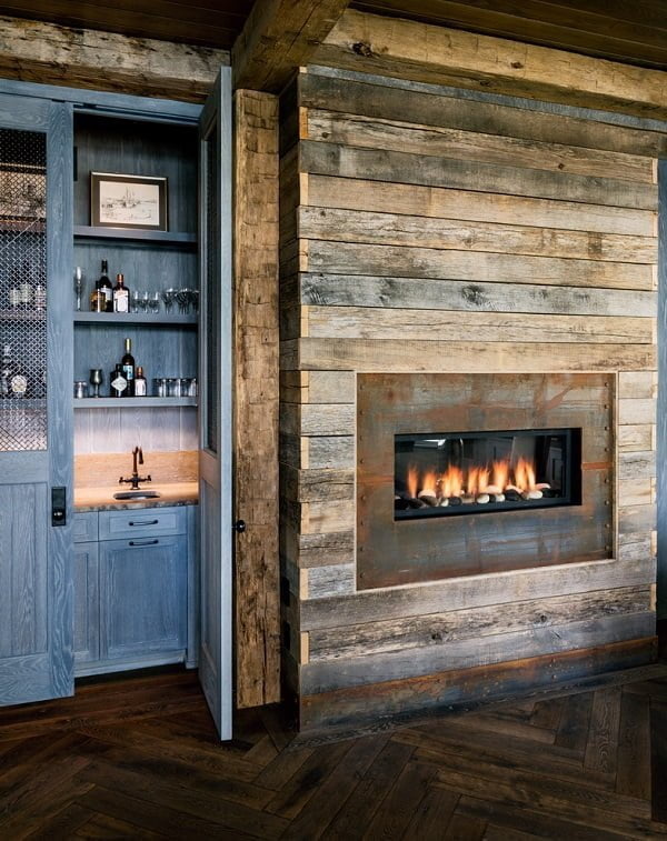 living room decor idea with built-in fireplace and secluded kitchen. Love it!
