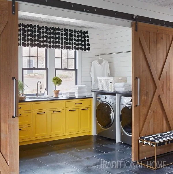 100 Fabulous Laundry Room Decor Ideas You Can Copy - You have to see this decor idea with bright yellow cabinets and innovative metalic washing machines. Love it!