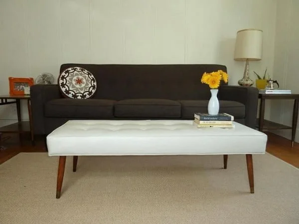Check out the tutorial on how to make a DIY mid century modern bench. Looks easy enough! 