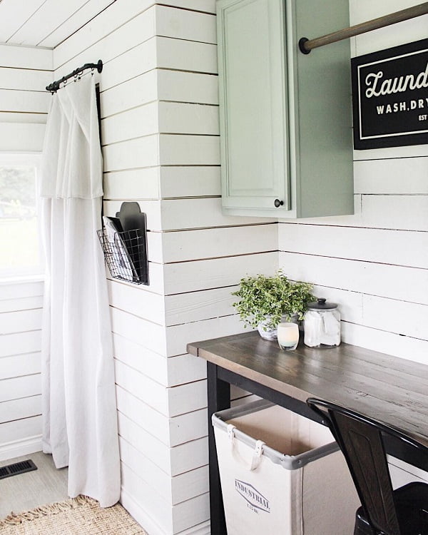  decor idea with a single hanging cabinet and large laundry basket. Love it!   