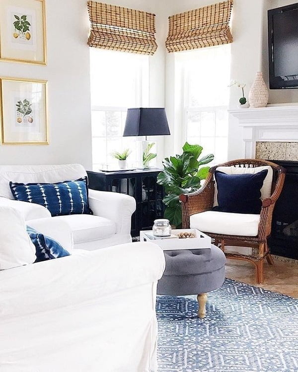  decor idea with white, stone fireplace and ottoman-like and suede coffee table. Love it!   