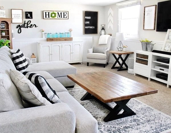  decor idea with staggering black wall art and udner-the-window armchair with nightstand. Love it!   