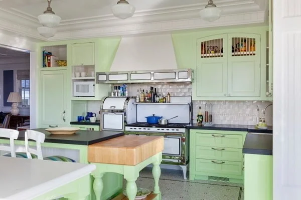 Antique style green kitchen cabinets