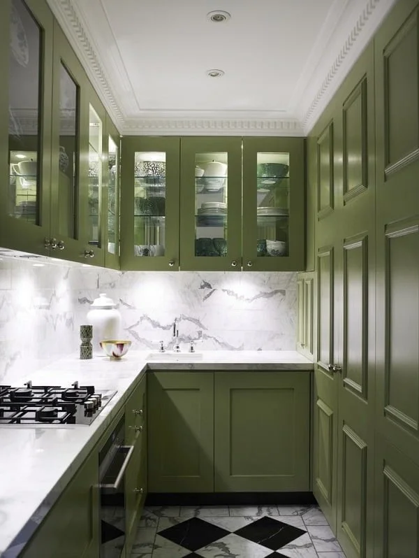 Lime green kitchen cabinets against marble