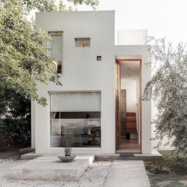 Minimalist House with Unusually Tall Door 