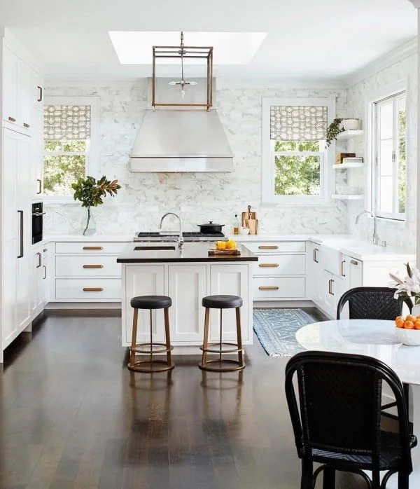 White Kitchen Cabinets with Full Marble Walls 