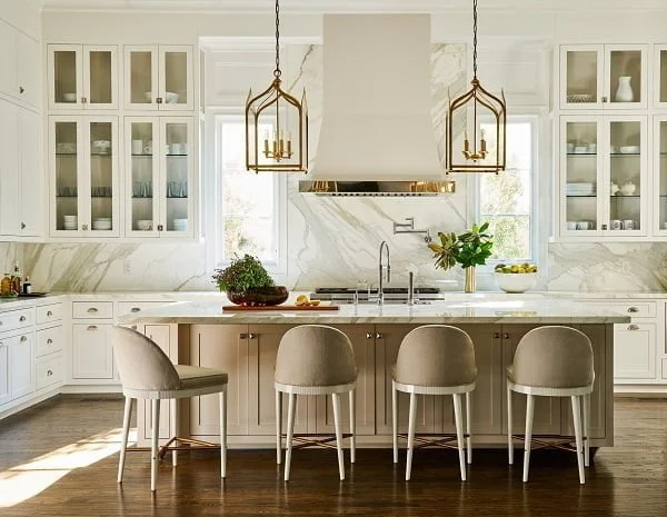 White Kitchen Cabinets with Marble Countertops and Walls 