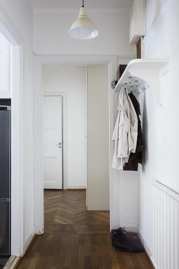 DIY Coat Rack: Hooks Mounted Under a Shelf for Entryway Storage