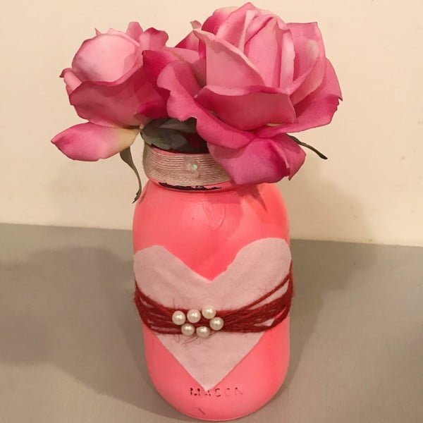 Make this Easy and Quick DIY Valentine's Day Mason Jar Centerpiece for less than $5.   