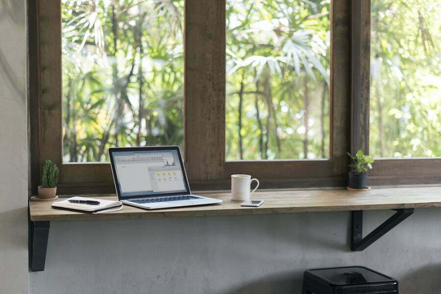 laptop on a window sill