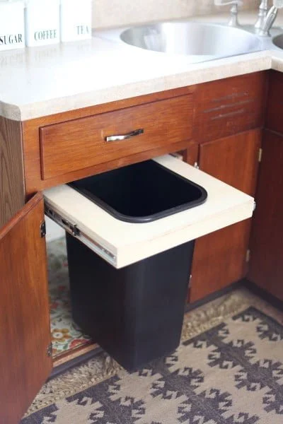 abeautifulmess.com DIY cabinet trash can