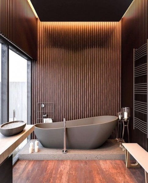 Warm Rough Bathroom with Industrial Touches concrete bathtub