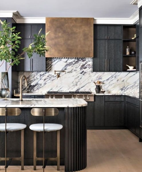 Marble and Brass Contrast with Textured Cabinets and Curved Island with Tonal Pinstripe marble backsplash