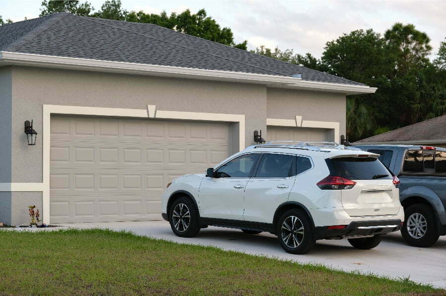 car on garage driveway