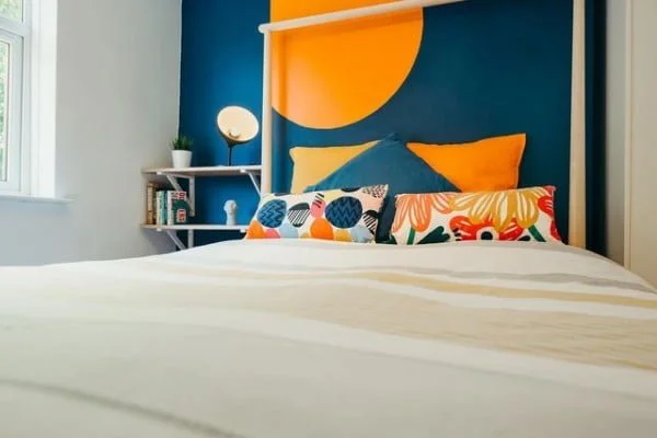 Vogue Abode Properties bedroom with feature wall