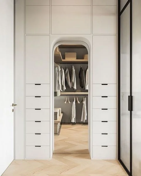 Light and Airy Closet bedroom with walk in closet