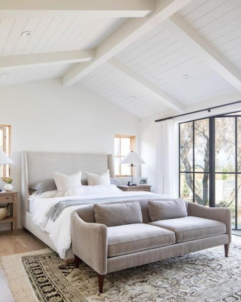 Welcome to this resort style, serene master bedroom oasis bedroom with white walls
