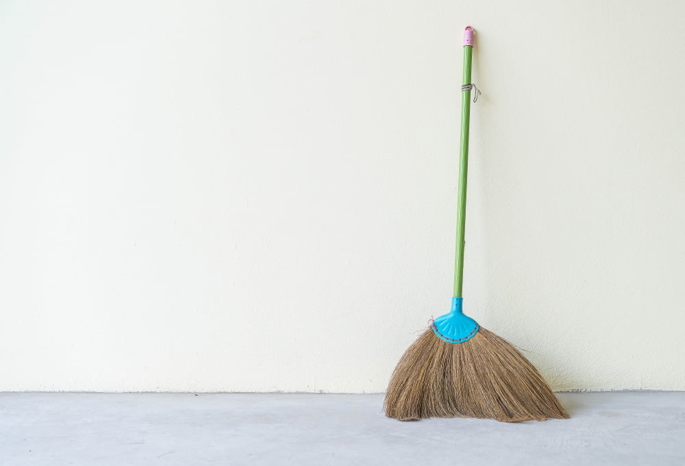 Broom cleaning home