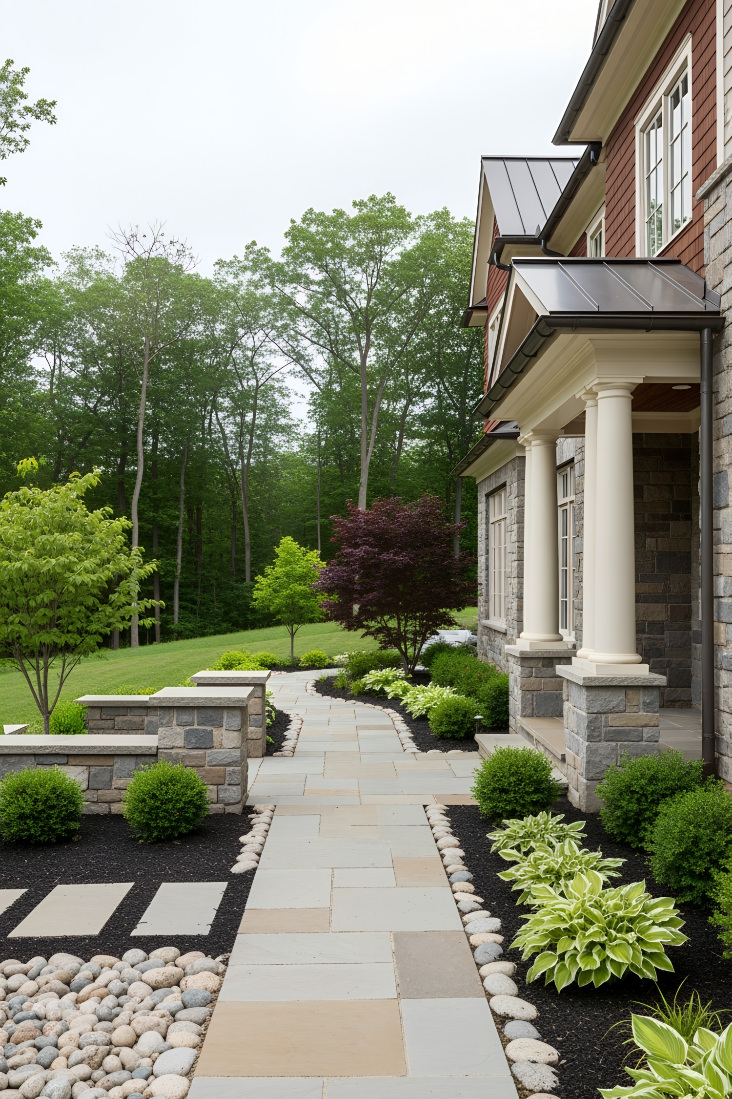 Stone walkway surrounded by lush greenery and a stately house