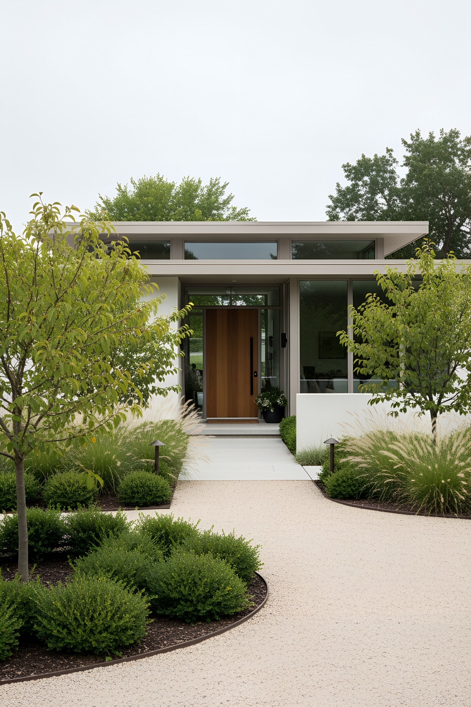 Modern house with a sleek path leading through lush greenery