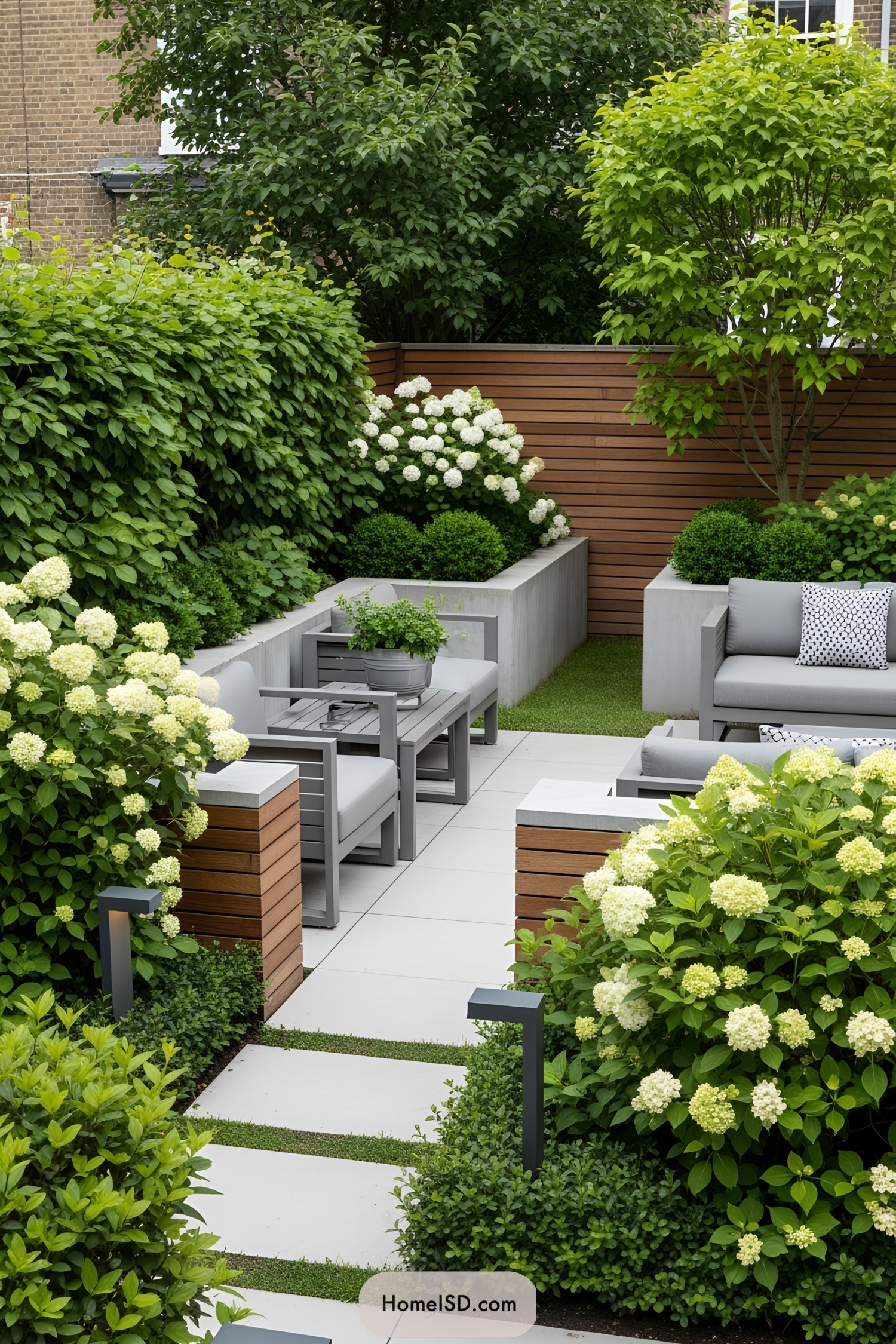 Stylish patio with lush greenery and cozy seating