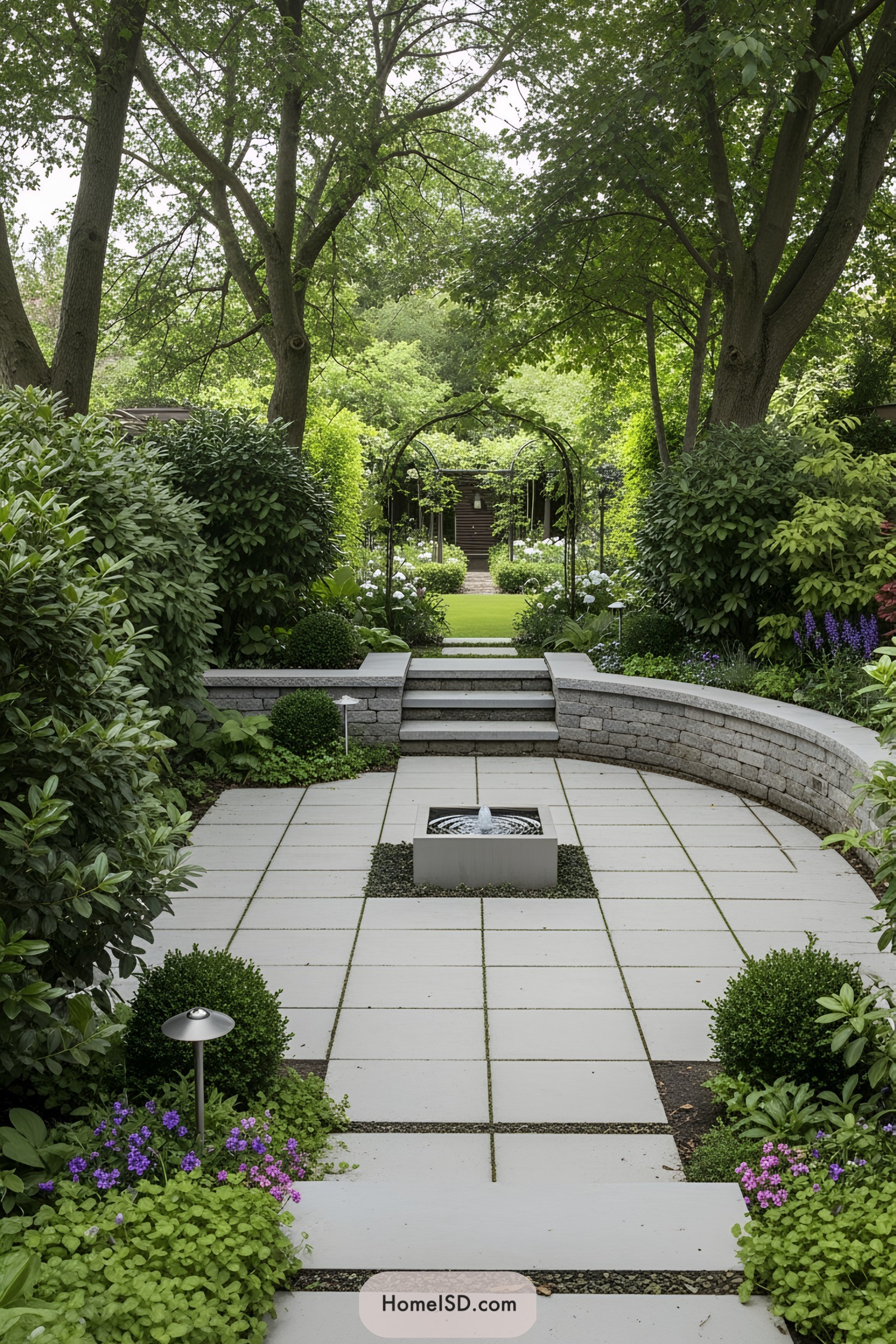 Modern garden with stone path and fountain