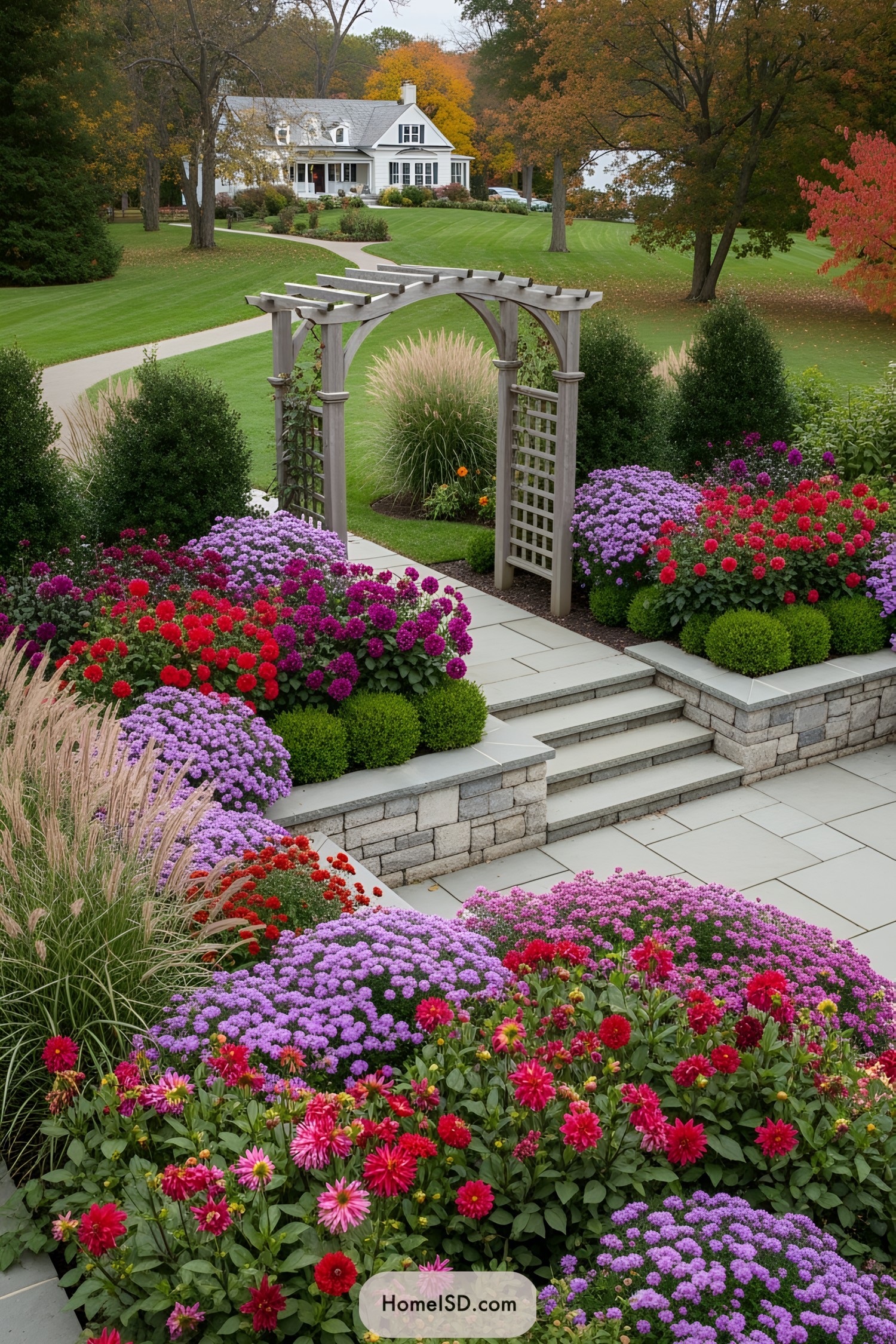 Colorful fall garden with stone pathway and arch