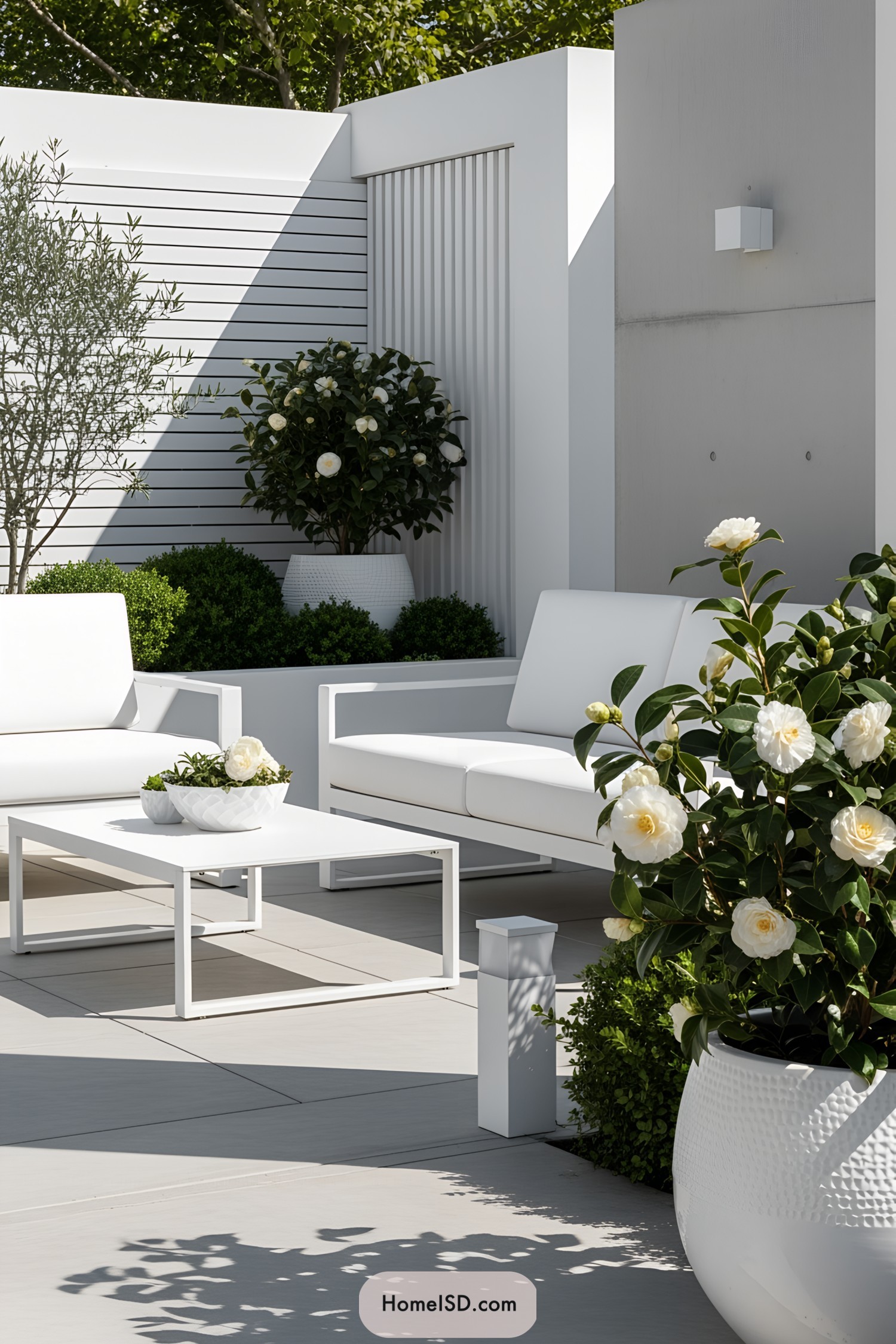 White flower pots on modern terrace with seating