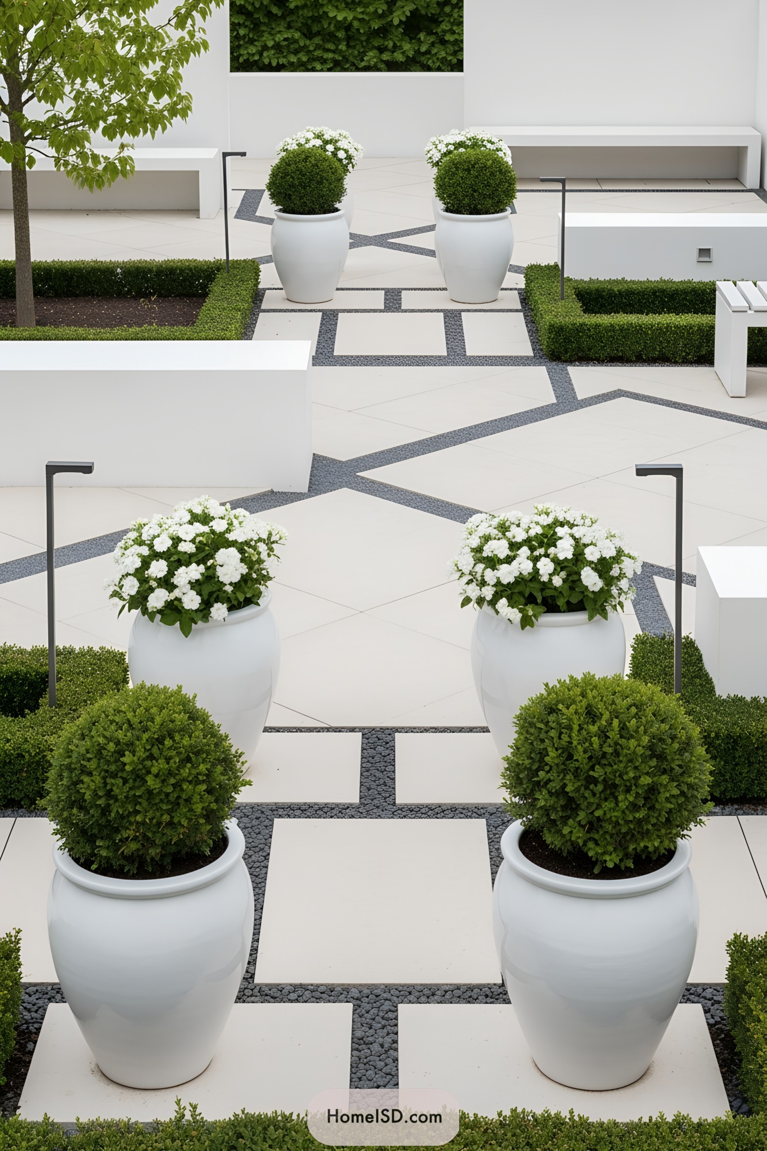 Stylish white pots on a modern patio