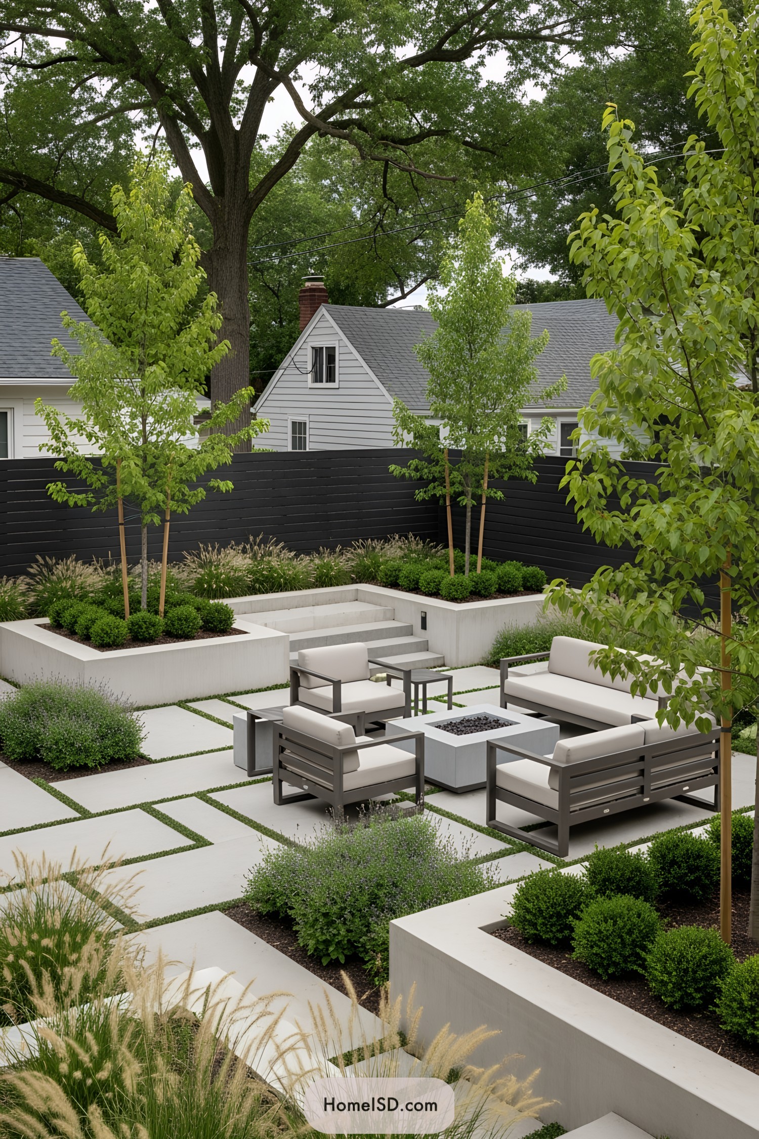 Modern outdoor space with sleek seating and lush greenery