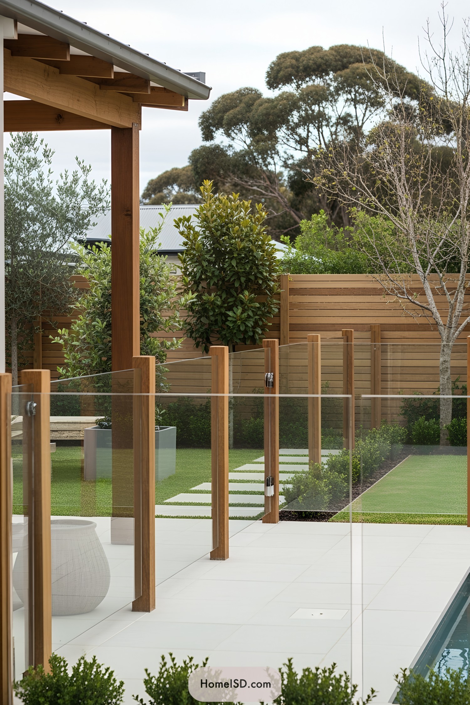 Glass fence enhancing a modern pool setup