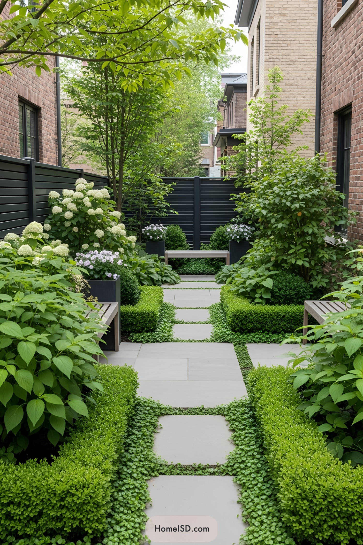 Lush garden with a stylish fence and vibrant plants