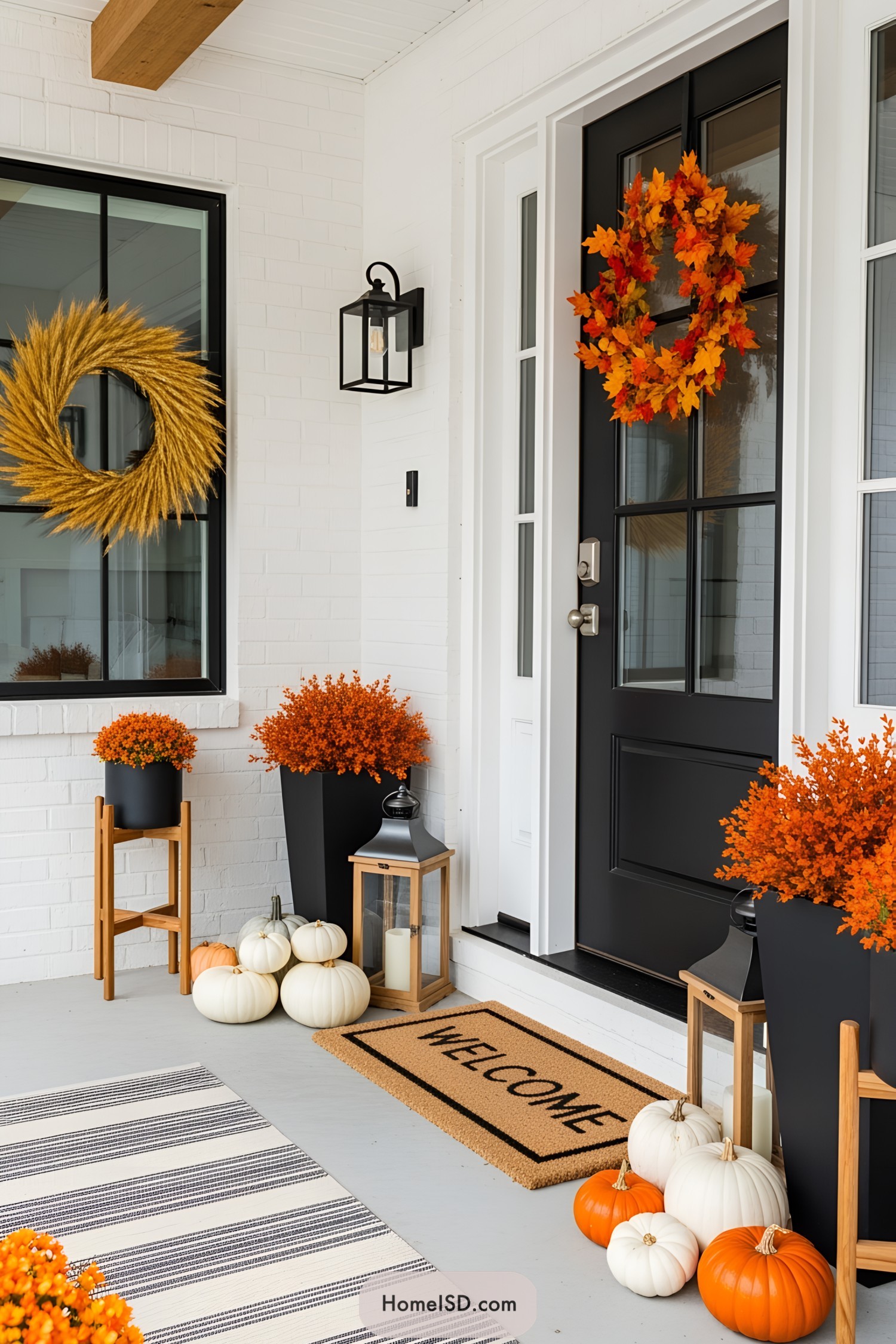 Bright fall wreaths and pumpkin clusters on a porch