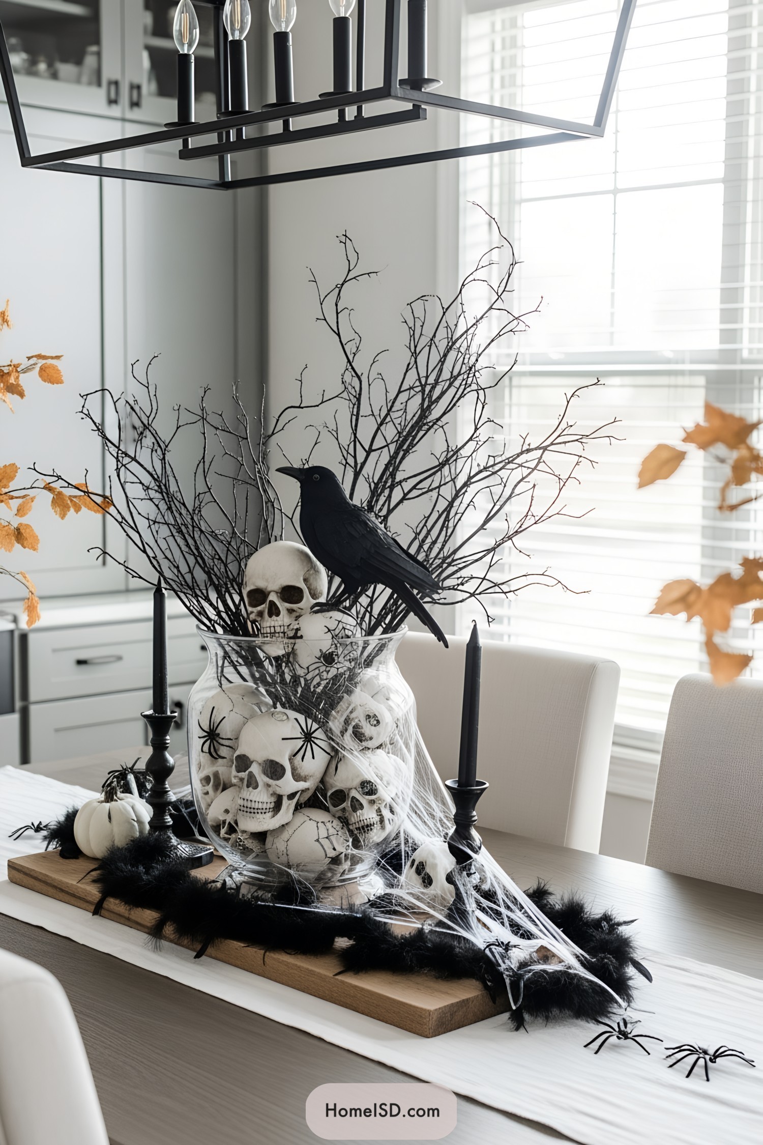 A spooky Halloween centerpiece with skulls and a crow