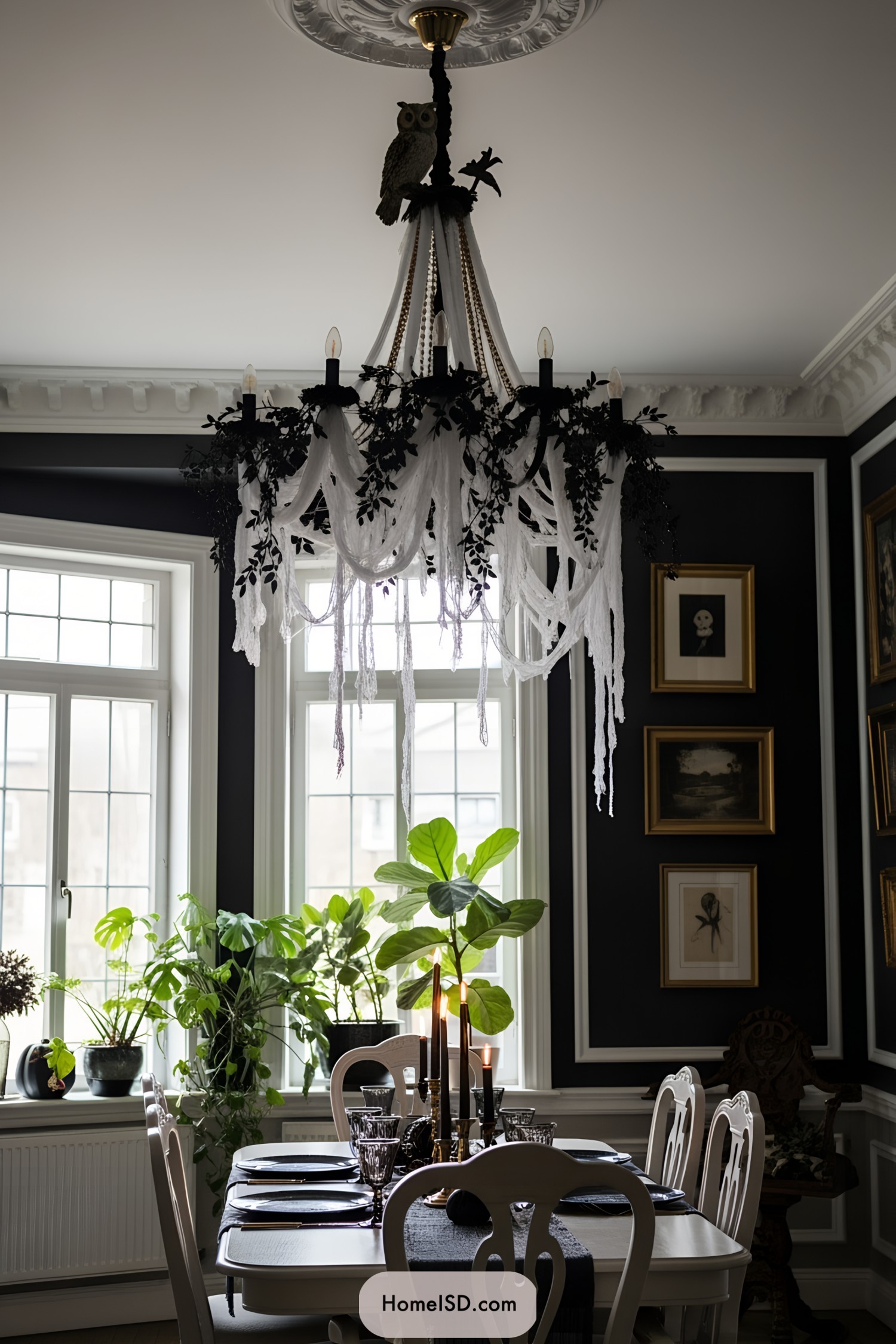 Spooky-themed dining room with leafy chandelier and candles
