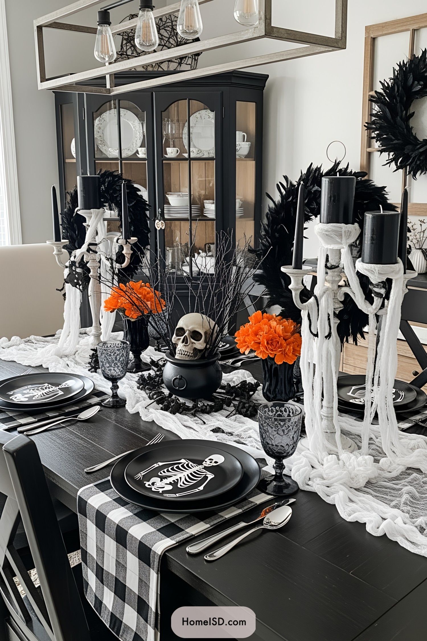 Elegant Halloween-themed table setup with skeleton plates and spooky décor