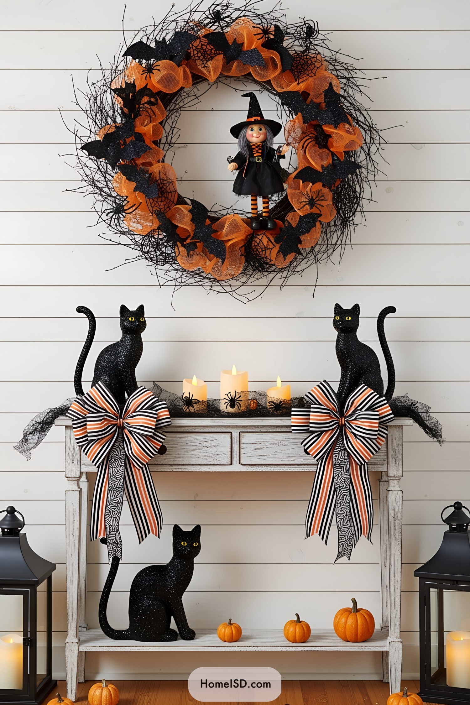 Halloween wreath with a playful witch, surrounded by black cats and pumpkins