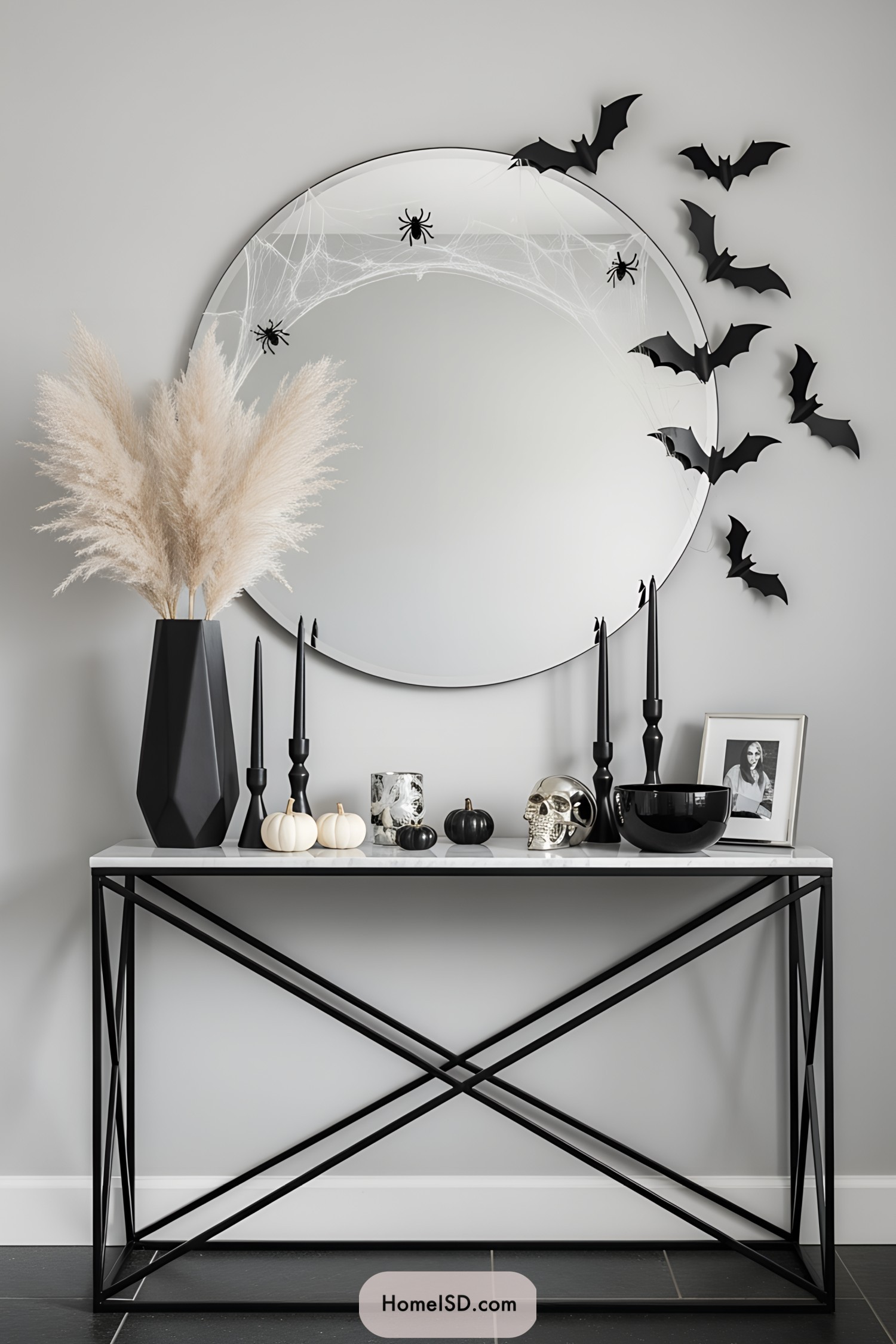 Halloween-themed entryway decor with a mirror and bats
