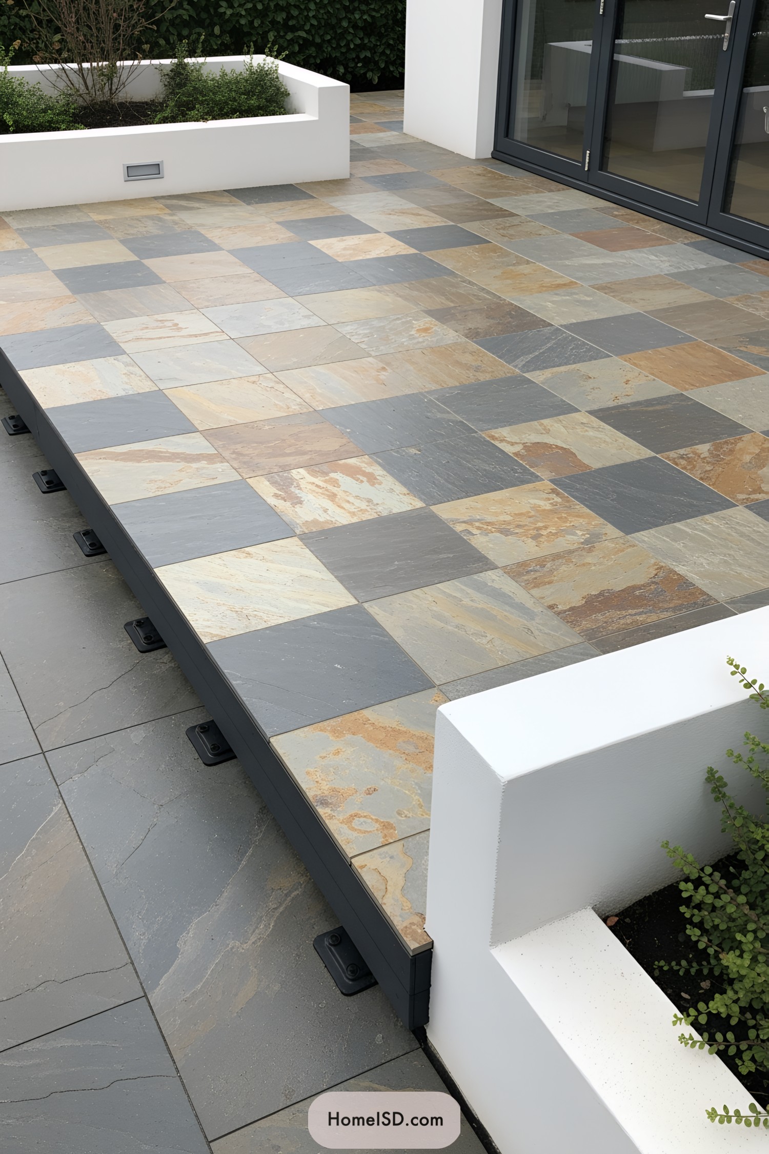 Floating deck with multicolored tiles and white planters