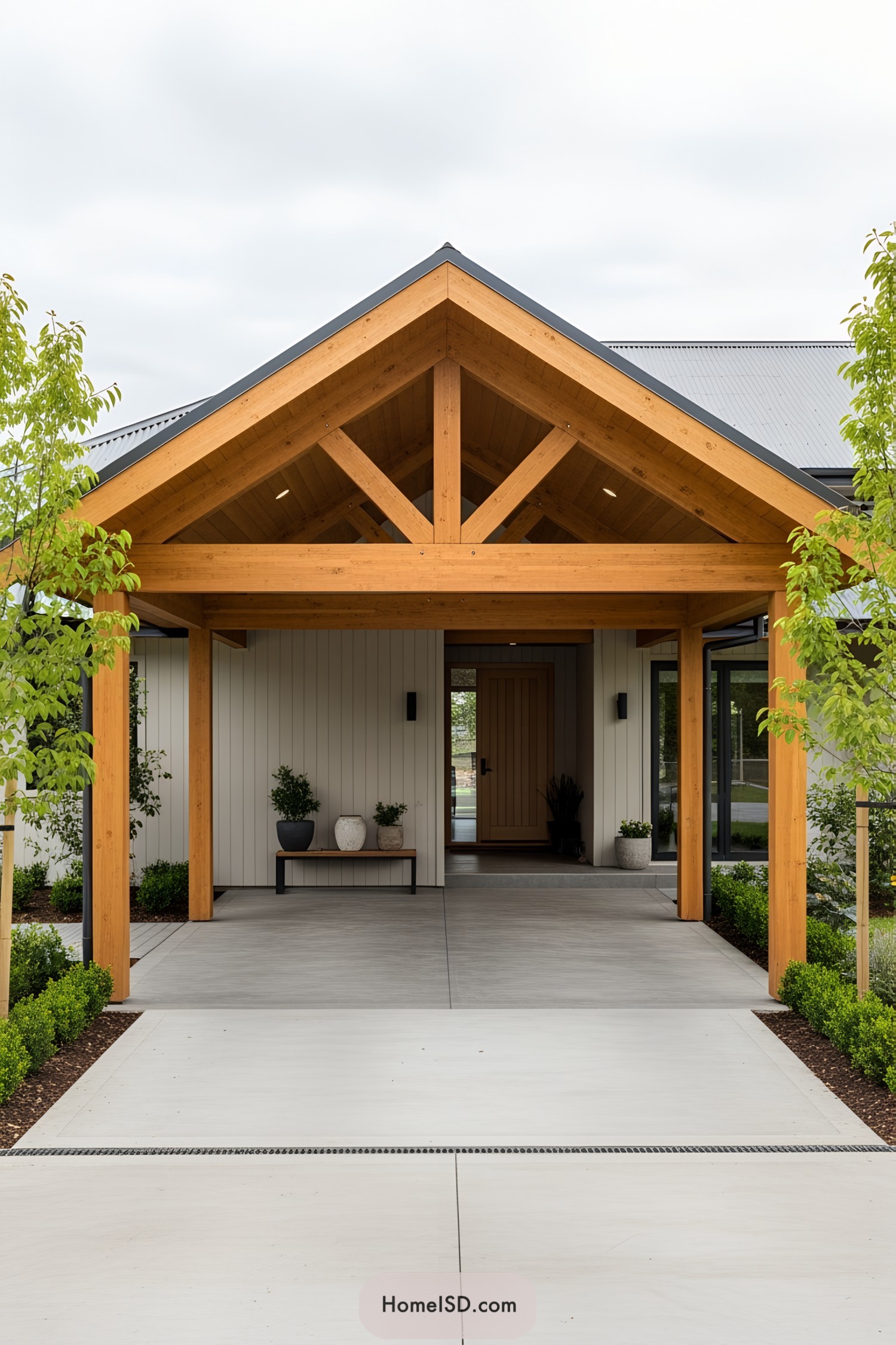 Wooden carport with gable roof and plants