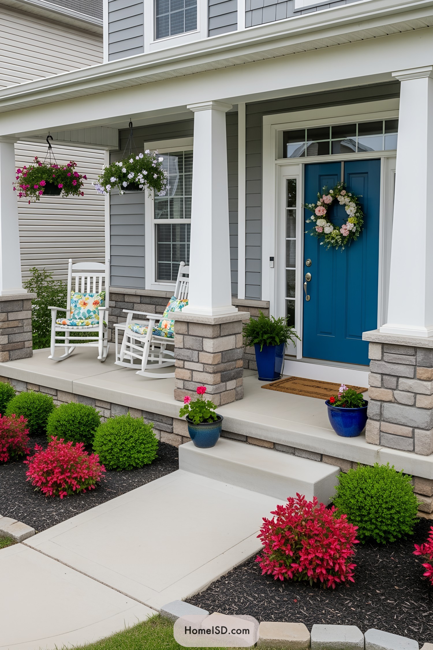 Colorful porch with blue door and rocking chairs