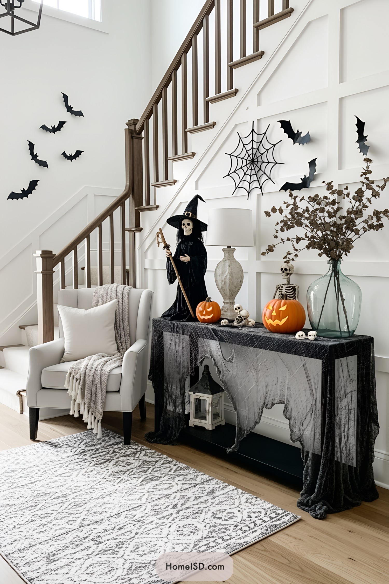 Halloween decorations with witch figurine and pumpkins