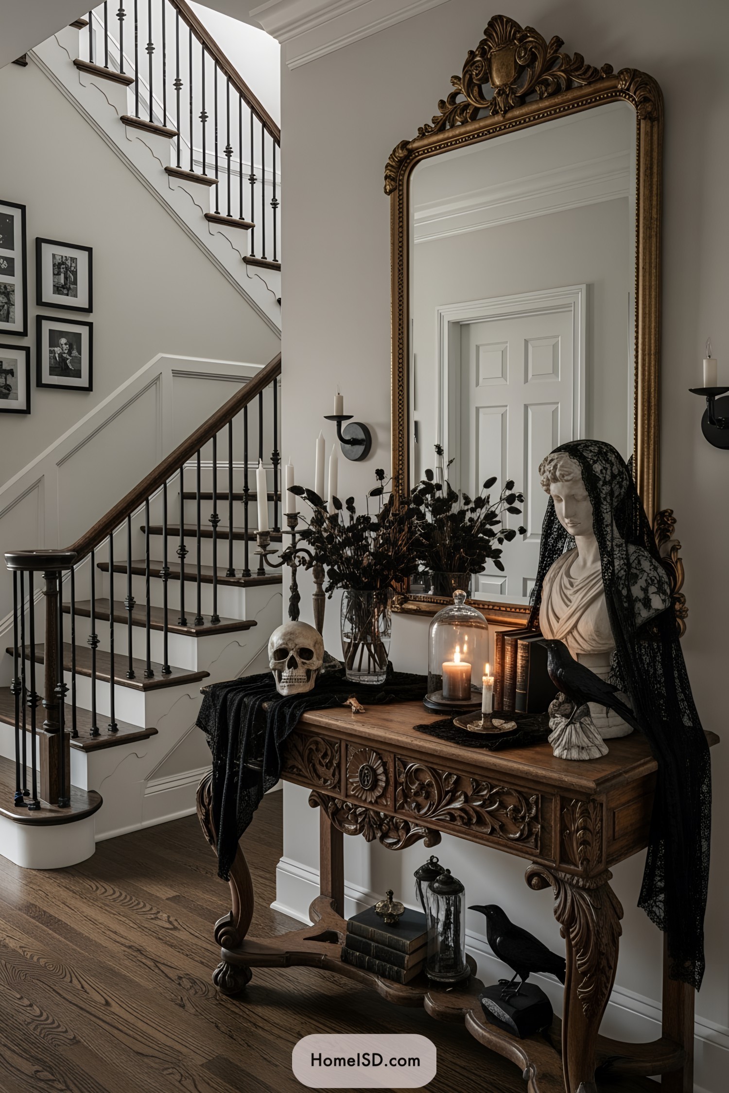 Halloween-themed entryway with a mirror, skull, bust, and candles