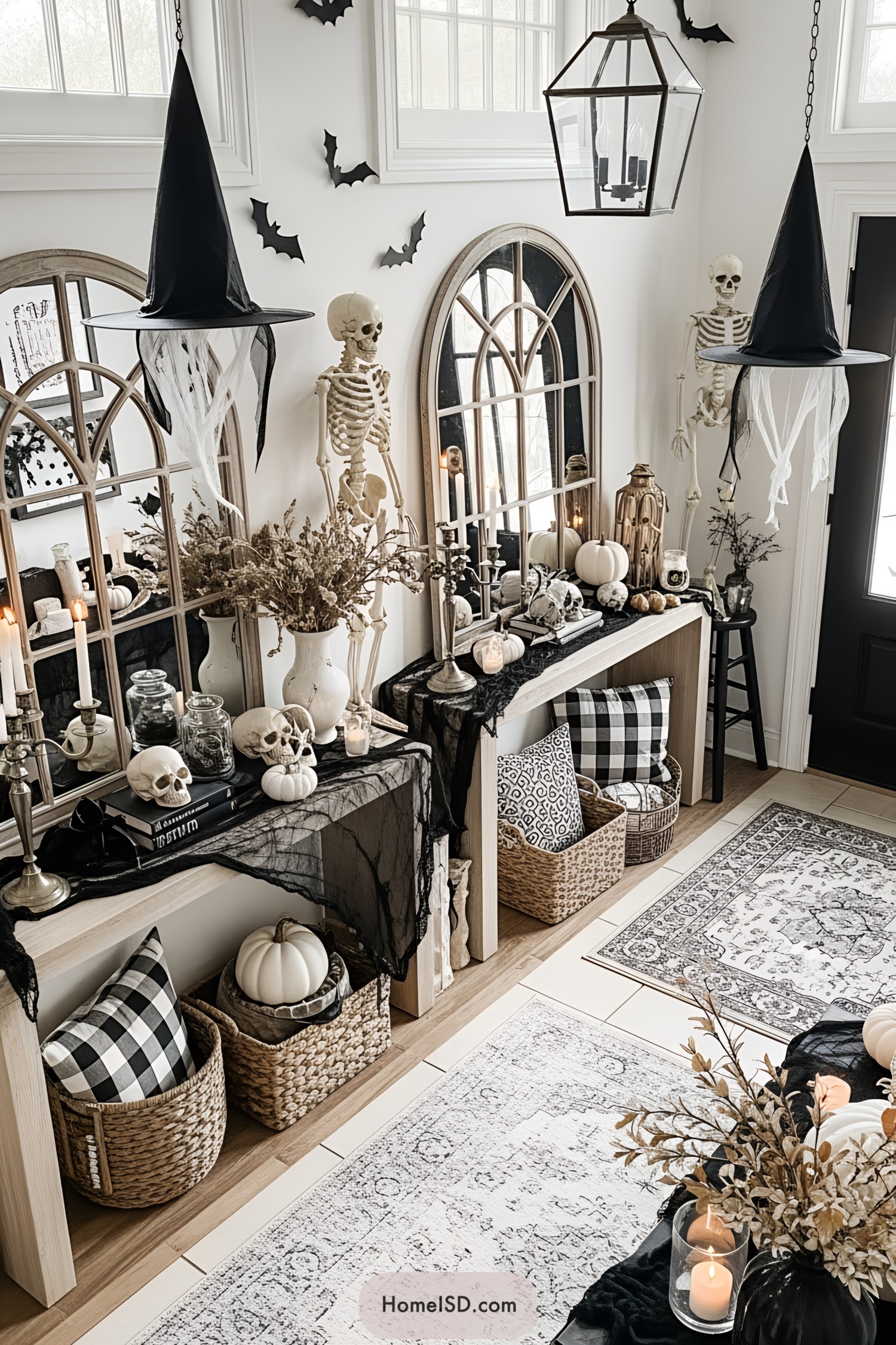 Halloween-themed entryway with skeletons, pumpkins, and witch hats
